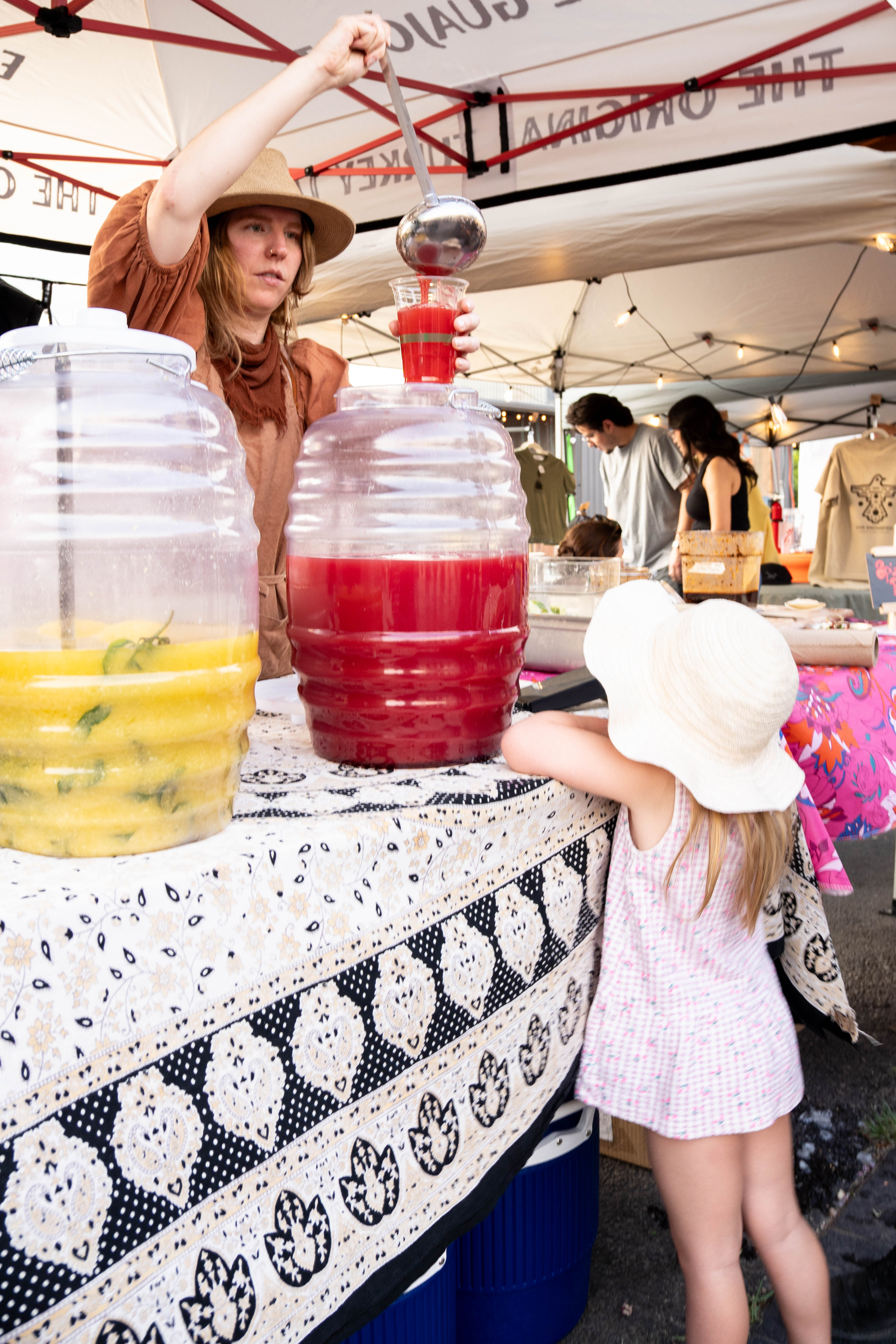 Kearsley serving aguas frescas